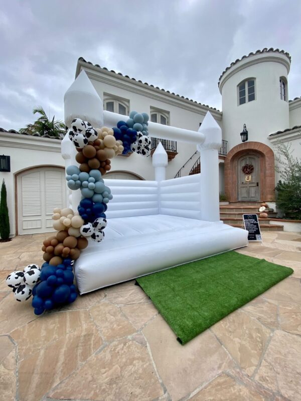 Beautifully Decorated Cirrus White Colored bounce house with Colored Balloons