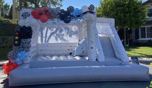 Decorated Beautiful White and Black Combo bounce house with Balloons